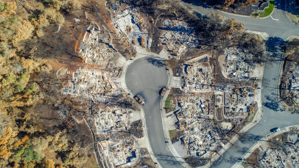 drone-shot-of-a-destroyed-neighborhood-3964366 Aerial view of Santa Rosa neighborhood devastated by Tubbs Fire. Burned homes visible.